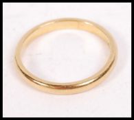A vintage 22ct gold band ring being hallmarked for London, date letter P. Total weight 2.9g / Size