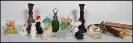 A collection of vintage perfumes and after shave bottles with contents to include, figural,