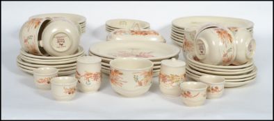 An extensive Poole Pottery ' Summer Glory ' pattern dinner and tea service. The set comprising