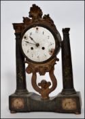 A 19th century Italian portico clock raised on a marble twin column stand with barrel movement and