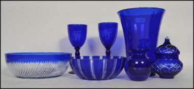 A collection of blue glass to include Bristol Blue goblets and squat vase, believed Victorian