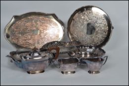 A vintage 20th century silver plated tea service together with a selection of silver plated trays,