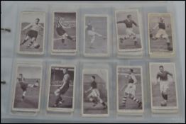An album of vintage cigarette cards to include Churchman's, Players, Wills,and topics to include