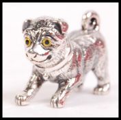 A contemporary cast silver charm figure / pendant  having glass eyes and the tail as a bale loop.