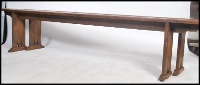 A nice long pair of 19th century French refectory pig benches. Each with shaped single plant tops of