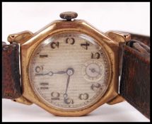 An early 20th century vintage gentleman's 9ct / 375 gold marked wristwatch set to a believed