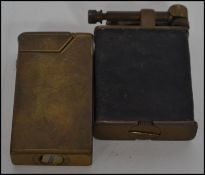 A fabulous mid 20th century Dunhill petrol lighter together with another lighter of similar age.