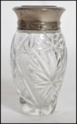 A vintage Ralph Lauren Polo glass scent bottle with silver plated lid with label to base