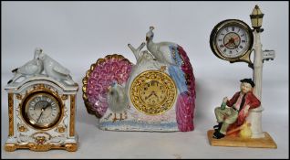 A group of three vintage kitsch ceramic mantel clocks. One in the form of a peacock, one in the form