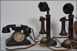 A pair of vintage 1930's brass and bakelite internal stick telephones together with a mid 20th