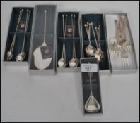 A collection of boxed German silver plated dessert cutlery to include cake server, dessert spoons
