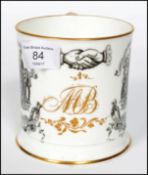 A 19th century Victorian porcelain Masonic mug depicting the coat of arms and figures with gilt