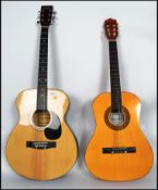 Two vintage acoustic 6 string guitars, one being a