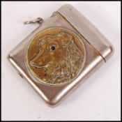 A vintage silver white metal vesta case having a c
