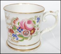 A mid 19th century Victorian Staffordshire ceramic anti slavery mug being hand painted with