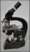 A Ernst Leitz Wetzlar Binocular Microscope,having  four objectives and serial number 519-748, with