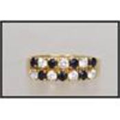 An 18ct gold ring  with pave set sapphire and white stones. Marked 750 tests 18ct gold  . Weight 2.