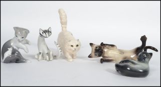 A collection of cat figurines to include Royal Doulton white Persian cat together with a Beswick