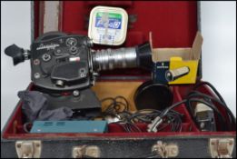 A vintage original early 20th century Beaulieu cine camera complete in the original case being