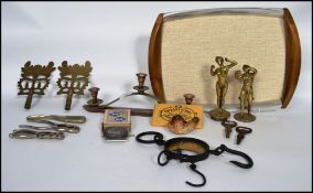 A collection of vintage brass items to include bottle openers in the form of naked females,