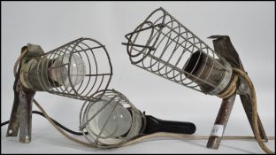 A group of three retro / vintage 20th century caged industrial inspection lamps - trouble lamps
