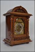 A 19th-century walnut mantel clock having a dome top raised on columns, the clock has a 3 train