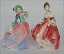 A pair of Royal Doulton ceramic figurines to include Autumn Breeze HN 1911 and Southern Bell HN