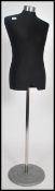 A retro style 20th century tailors haberdashery mannequin / shop dummy raised on a polished