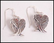 A pair of 20th century decorative silver ladies ea