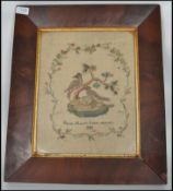 A 19th century Victorian period framed and glazed needlepoint tapestry sampler depicting nesting