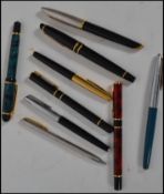 A collection of 20th century pens ( nine in total ) to include Watermans fountain ink pens one