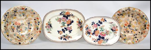 A collection of 19th century Staffordshire cabinet plates, to include a pair of Imari style bowls