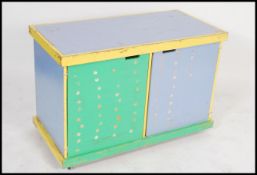 A 20th century Industrial beech wood school cupboa