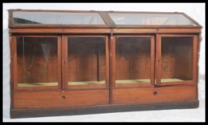 An impressive 20th century large Italian shop / museum display cabinet.  Of large form with mirror