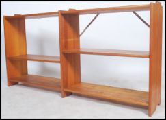 A retro 20th century modular pine open wall unit, having adjustable shelves together with another