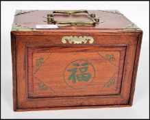A mid 20th century cased Mahjong bone and bamboo tiled set in it's original case with instructions.