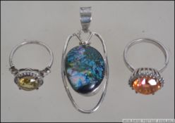 Two silver ( 925 ) rings. The first size P with a large Padparadscha colour 5.62 ct Quartz stone