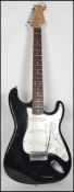 A vintage six sting electric guitar by Conrad having a stratocaster type body in white with white