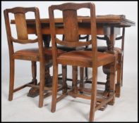 A 1940's / 1950's post war Art Deco oak dining room suite by Ercol. The set comprising draw leaf