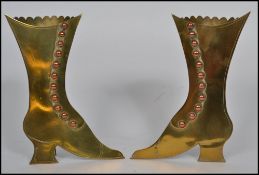 A pair of Victorian brass and copper mounted easel spill vases, each in the form of a lady`s boot,