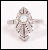 A 1930's Art Deco silver and opal ladies dress rin