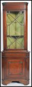 A good mahogany Georgian revival astragal glazed display corner cabinet having lined shelves over