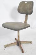 A vintage mid century operators Industrial swivel desk chair. Original enamel painted metal and