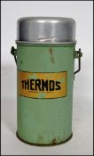 An original vintage metal cased 'Thermos' flask in green with notation to front.