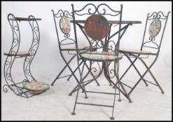 A vintage garden table, 3 chairs and a 3 tier cake
