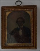 A 19th Victorian  Ambrotype photograph portrait study of a young man set in a gilt frame.