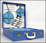 A vintage 20th century retro picnic hamper by Brexton to include flasks, sandwich boxes, plates,
