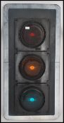 A large set of Industrial traffic lights complete with the blinker hoods and raised on tall