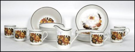 A retro 20th century floral tea service by Johnson Brothers consisting of cups, plates, creamer,