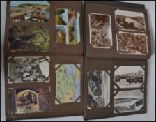 Two vintage postcard albums dating from the 20th century with several postcards predominately